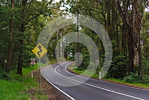 Curves and bends sign in yellow and black color