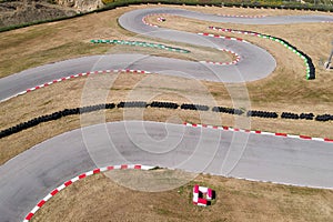 Curves on karting race track, aerial view background