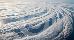 Curving cloud formations create a spiral