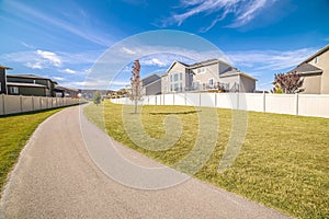 Curving pedestrian walkway in a greenbelt area