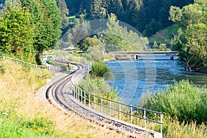 Curving railroad along a river