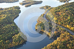 Curving road along Mississippi River during autumn