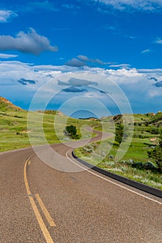 Curving Road Disappears Into The Hills