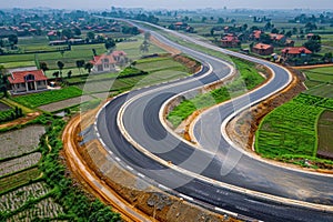 Curving Road Through Rural Farmland with Green Fields and Small Villages in the Distance