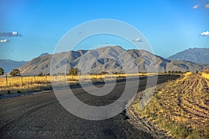 Curving road with West Mountain in the horizon