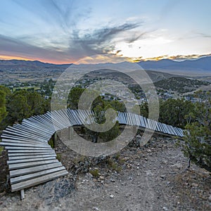 Curving wooden trail during beautiful sunset