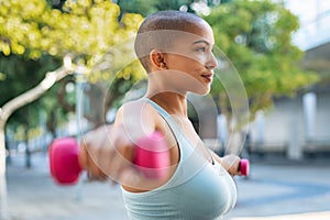 Curvy black woman using dumbbell