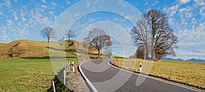 Curvy country road in hilly bavarian landscape