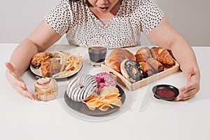 Curvy female preparing to eat hamburger, overeating problem, depression photo