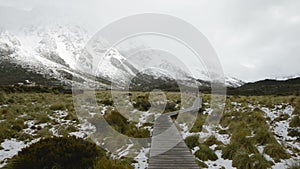 Curvy hanging pathway protects mountain ecosystem at Hooker Valley Track