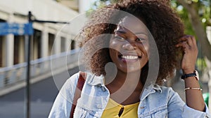 Curvy happy black woman looking at camera