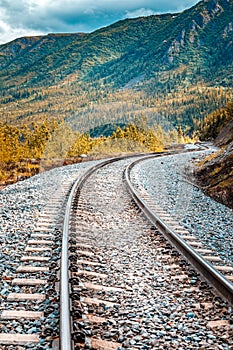 Curvy railroad in the wilderness of Alaska leading to Denali