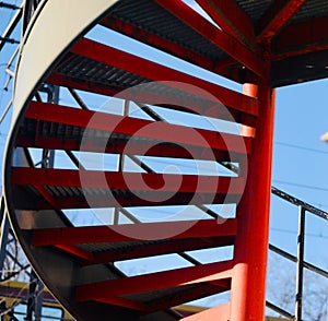 Curvy red metallic stairs isolated unique photo