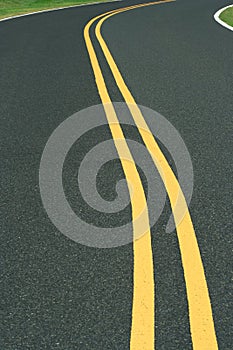 Curvy road with double yellow line