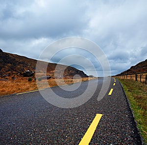 Curvy road in the Gap of Dunloe, County Kerry, Ireland