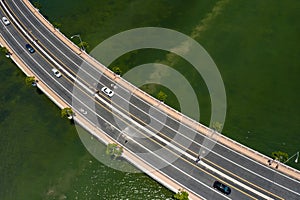 Curvy road over water. Shared bike lanes painted