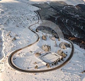 Curvy road in winter mountain