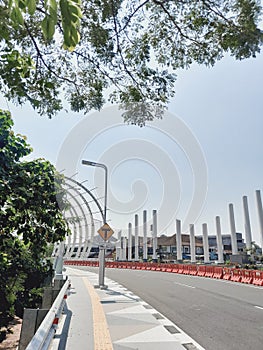 Curvy roads with caution warnings and junction road signs in Menara Pandang, Purwokerto.