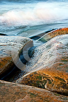 Curvy stones and wavy sea