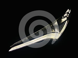 Curvy vehicle headlamps in black background