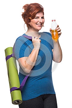 Curvy woman carrying yoga mat