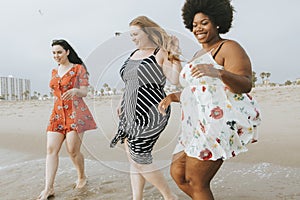 Curvy women at the beach photo