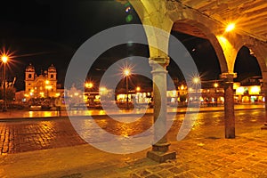 Cusco main square at night with Catholic religious cathedral