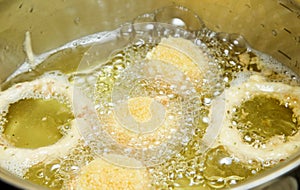 Cuscus and onions frying in oil