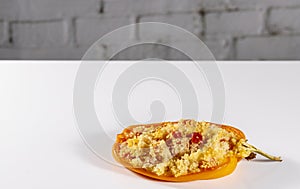 Cuscus, oven-roasted yellow pepper stuffed with couscous with vegetables