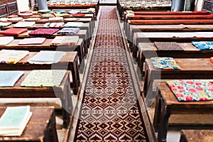 Cushions on empty church benches