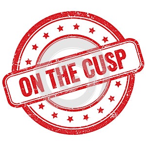 ON THE CUSP text on red grungy round rubber stamp photo