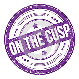 ON THE CUSP text on violet indigo round grungy stamp photo