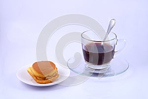 Custard Cake and coffee cup on white background