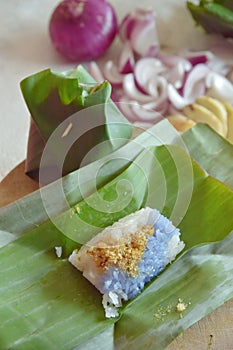 Custard rice. Sticky rice and egg custard wrapped in banana leaf.