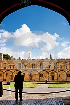 Custodian in archway. Oxford, UK