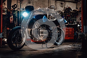 Custom bobber motorcycle in workshop or garage