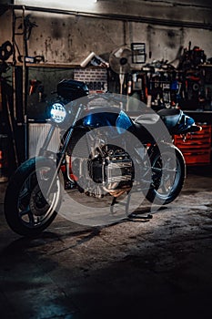 Custom bobber motorcycle in workshop or garage