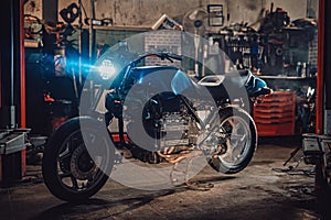 Custom bobber motorcycle in workshop or garage
