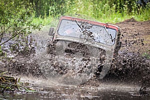 Custom built Off-road Trophy UAZ 469 in the swamp at high speed.