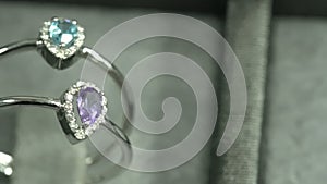 Custom design jewelery ring. handmade. rings with colorful gemstones. blue and purple gems.