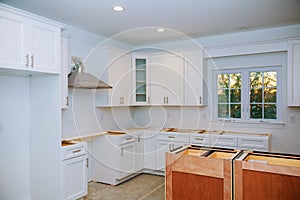 Custom kitchen cabinets in various stages of installation