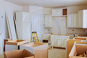 Custom kitchen cabinets in various stages of installation