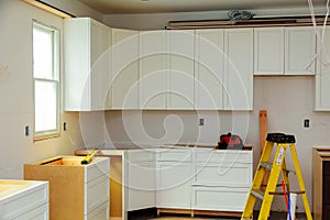 Custom kitchen cabinets in various stages of installation