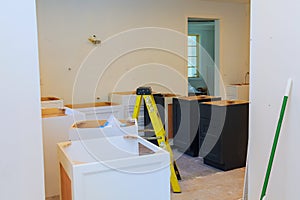 Custom kitchen cabinets in various stages of installation