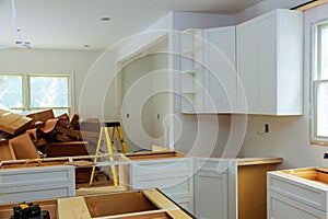 Custom kitchen cabinets in various stages of installation