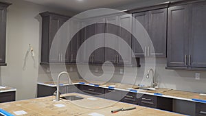 Custom kitchen cabinets in various stages of installation base for of kitchen cabinets