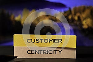 Customer Centricity on the sticky notes with bokeh background