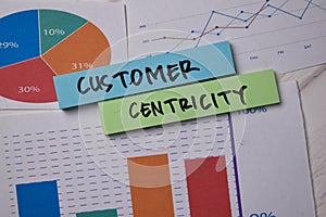 Customer Centricity write on sticky notes with graphic on the paper isolated on office desk