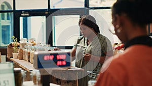 Customer checking organic bio merchandise in grocery store