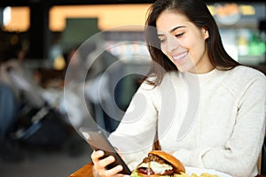 Customer checking phone in a restaurant